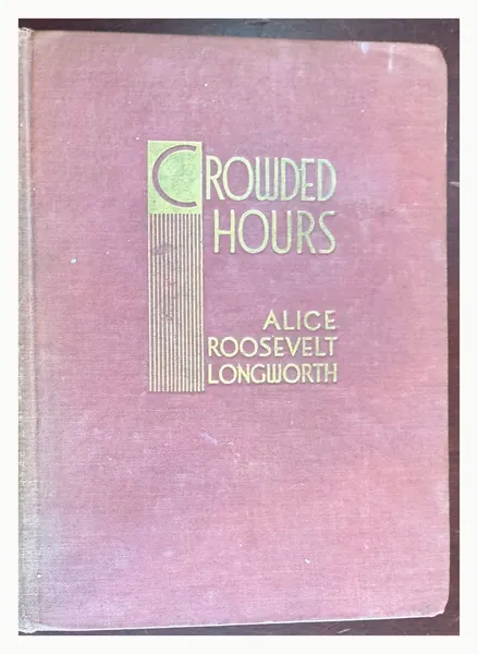 Front board of Crowded Hours in rose cloth with gilt and green design