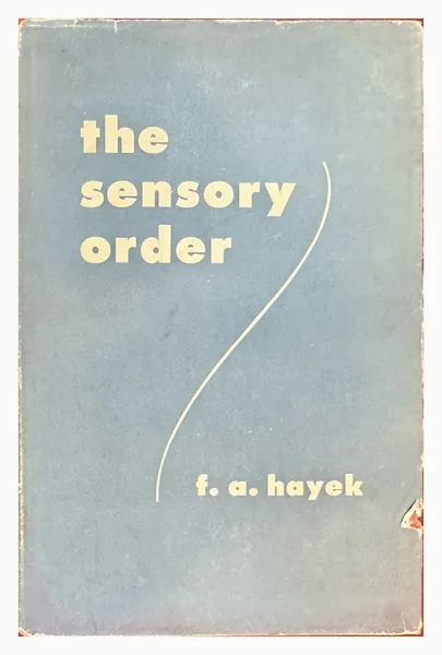 Blue dust jacket of The Sensory Order with cream lettering