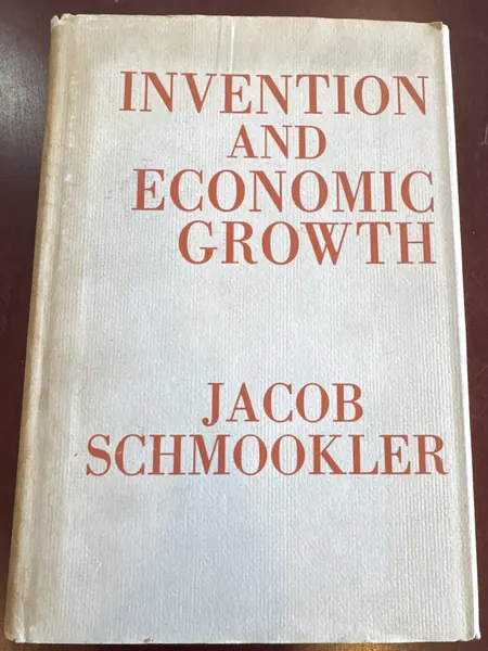 Cream dust jacket of Invention and Economic Growth lettered in red